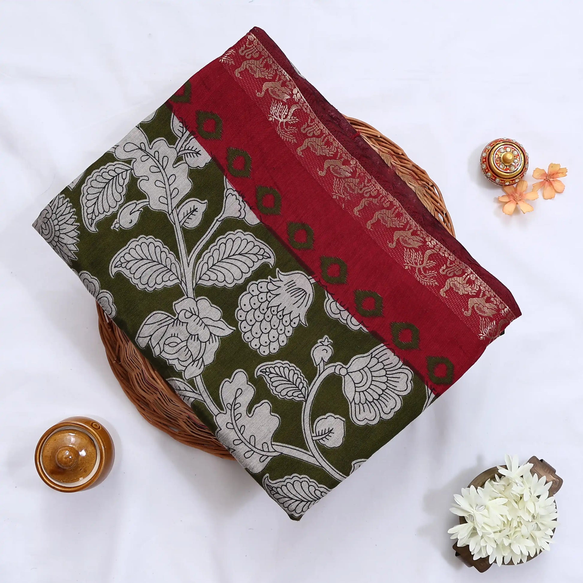Semi Chanderi saree with floral print maroon peacock zari border olive green body folded front view