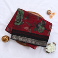 Pink Semi Chanderi saree with floral leaf print and contrast zari woven border folded flat lay display.