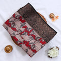 Semi Chanderi saree with cow motif print beige and red body with black zari border folded top view