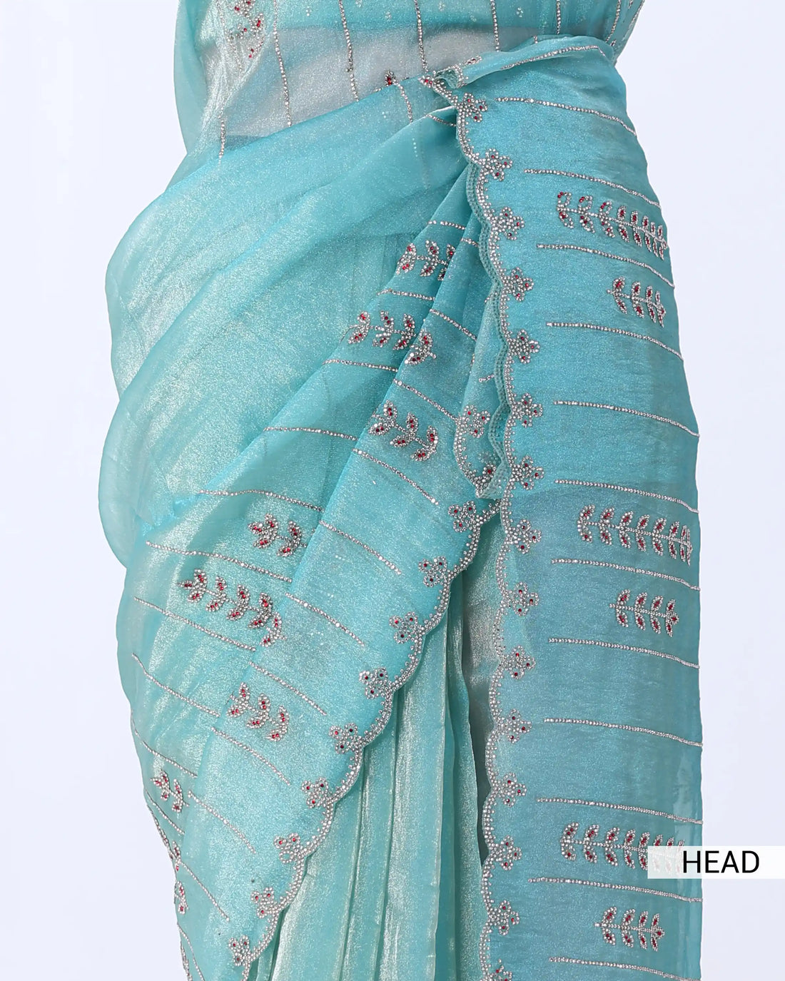A light turquoise blue saree with metallic gold zari embroidery