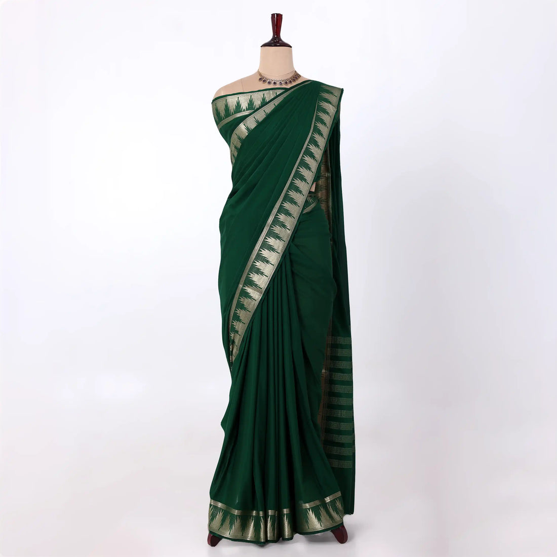Mysore Silk saree with plain bottle green body and golden zari woven border, front drape view