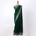 Mysore Silk saree with plain bottle green body and golden zari woven border, front drape view