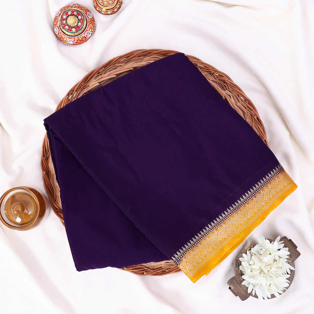 Mysore Silk saree with plain black body and gold with yellow zari woven border, front drape view