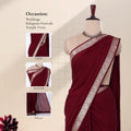Adeep maroon saree with a silver patterned border with details of head, blouse, and pallu