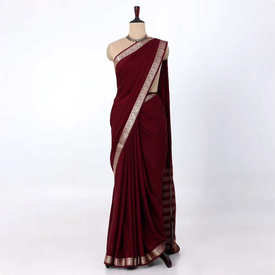 Mysore Silk saree with plain deep maroon body and silver zari woven border, front drape view