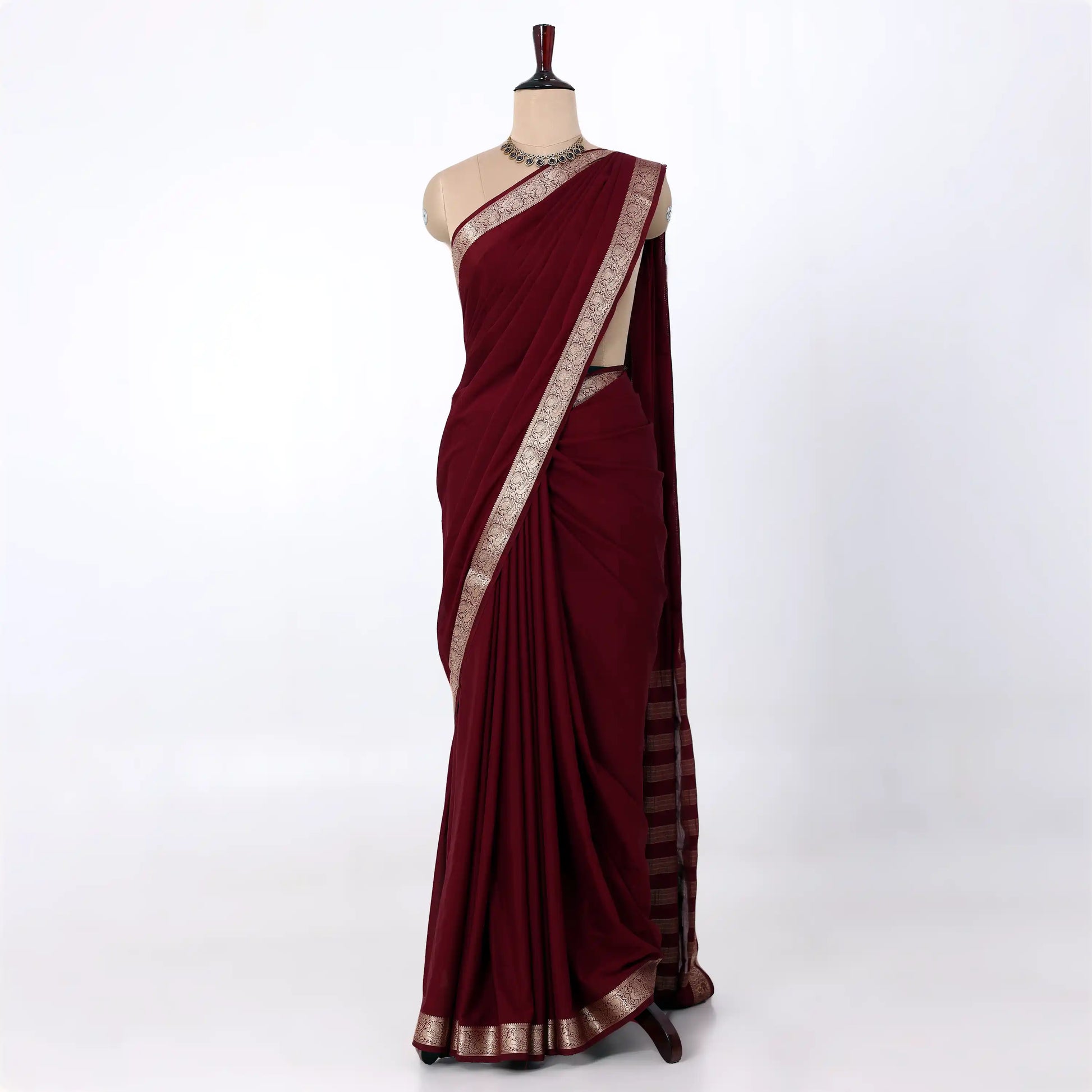 Mysore Silk saree with plain deep maroon body and silver zari woven border, front drape view