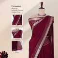A deep maroon red saree with a silver zari border with detail of showing the head, blouse, and pallu