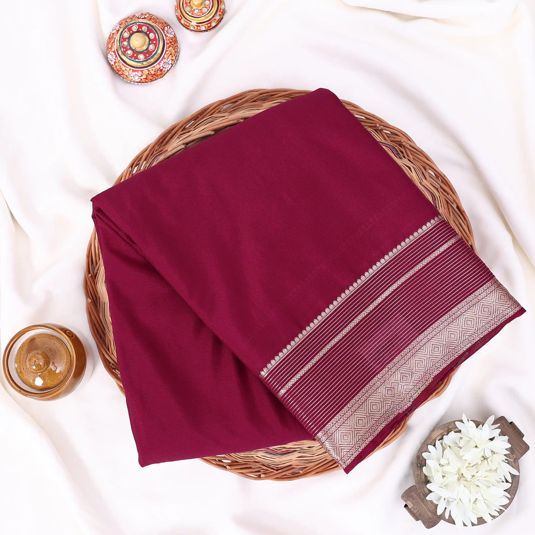 Mysore Silk saree with plain maroon body and gold zari woven border, front drape view