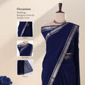 A navy blue saree with a silver border is with detail of  head, blouse, and pallu