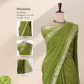 An olive green saree with a silver zari border with detail of  head, blouse, and pallu 