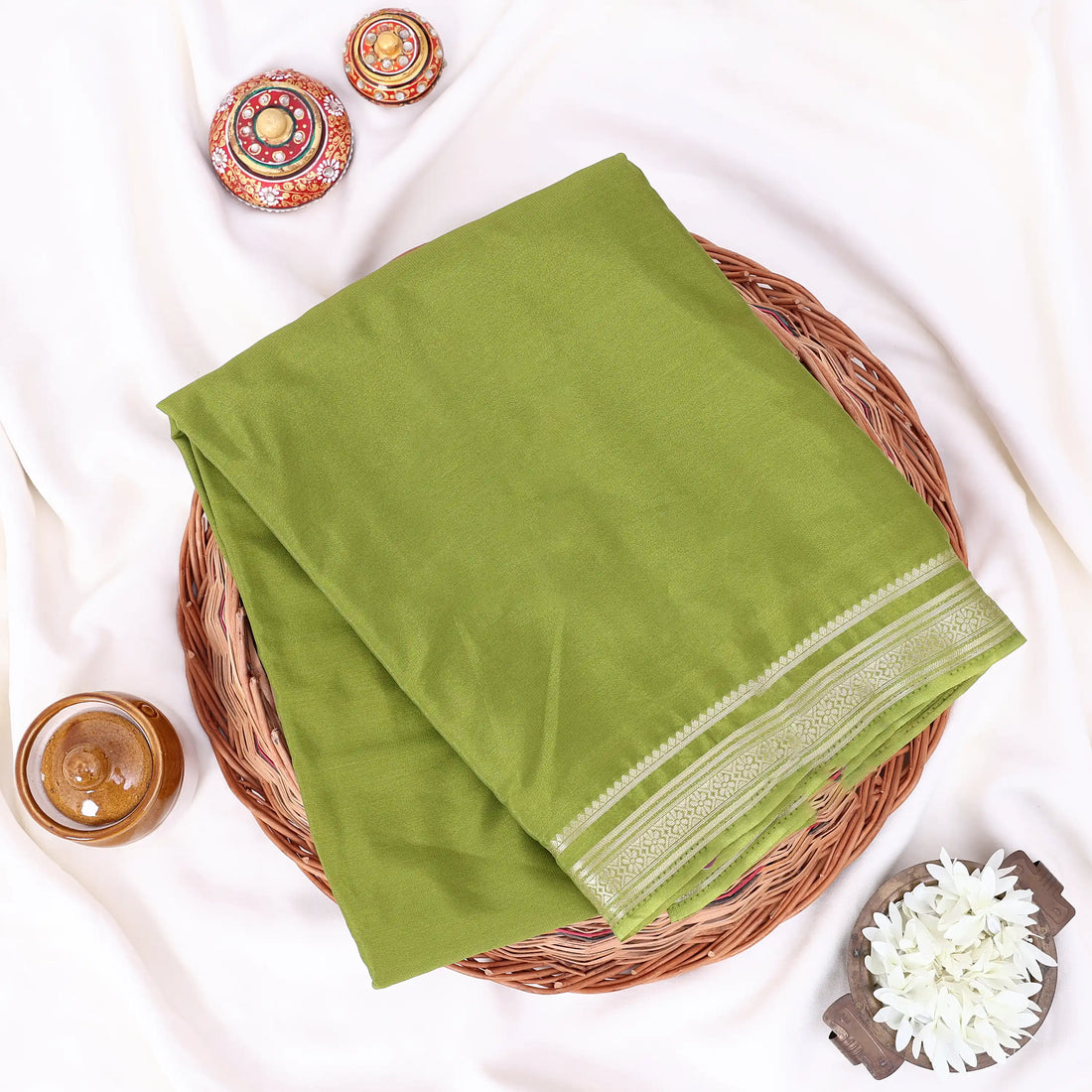 Mysore Silk saree with plain olive green body and golden zari woven border, front drape view