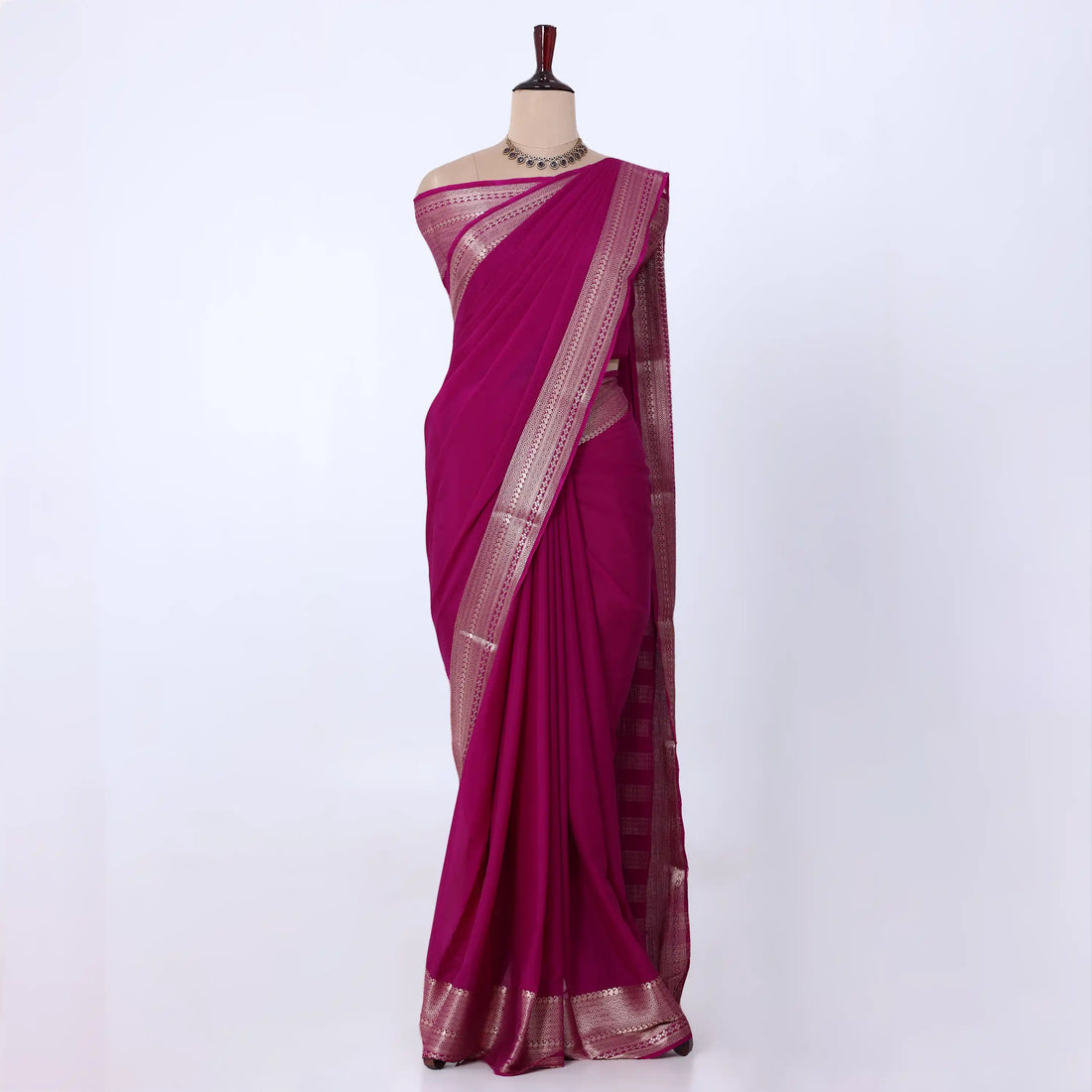 Mysore Silk saree with plain dark pink body and golden zari woven border, front drape view