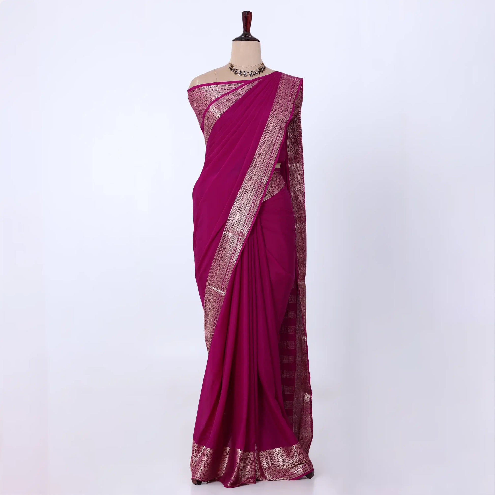 Mysore Silk saree with plain dark pink body and golden zari woven border, front drape view