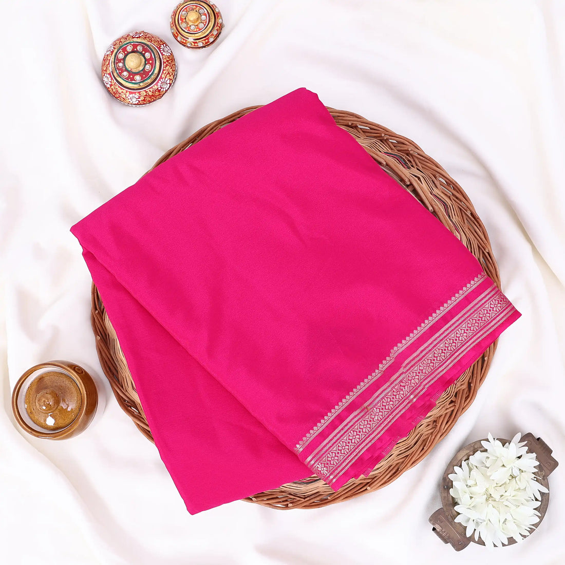 Mysore Silk saree with plain dark pink body and golden zari woven border, front drape view