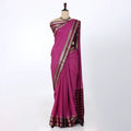 A magenta and pink saree with a maroon border and a maroon pallu, accented with gold zari metallic patterns.
