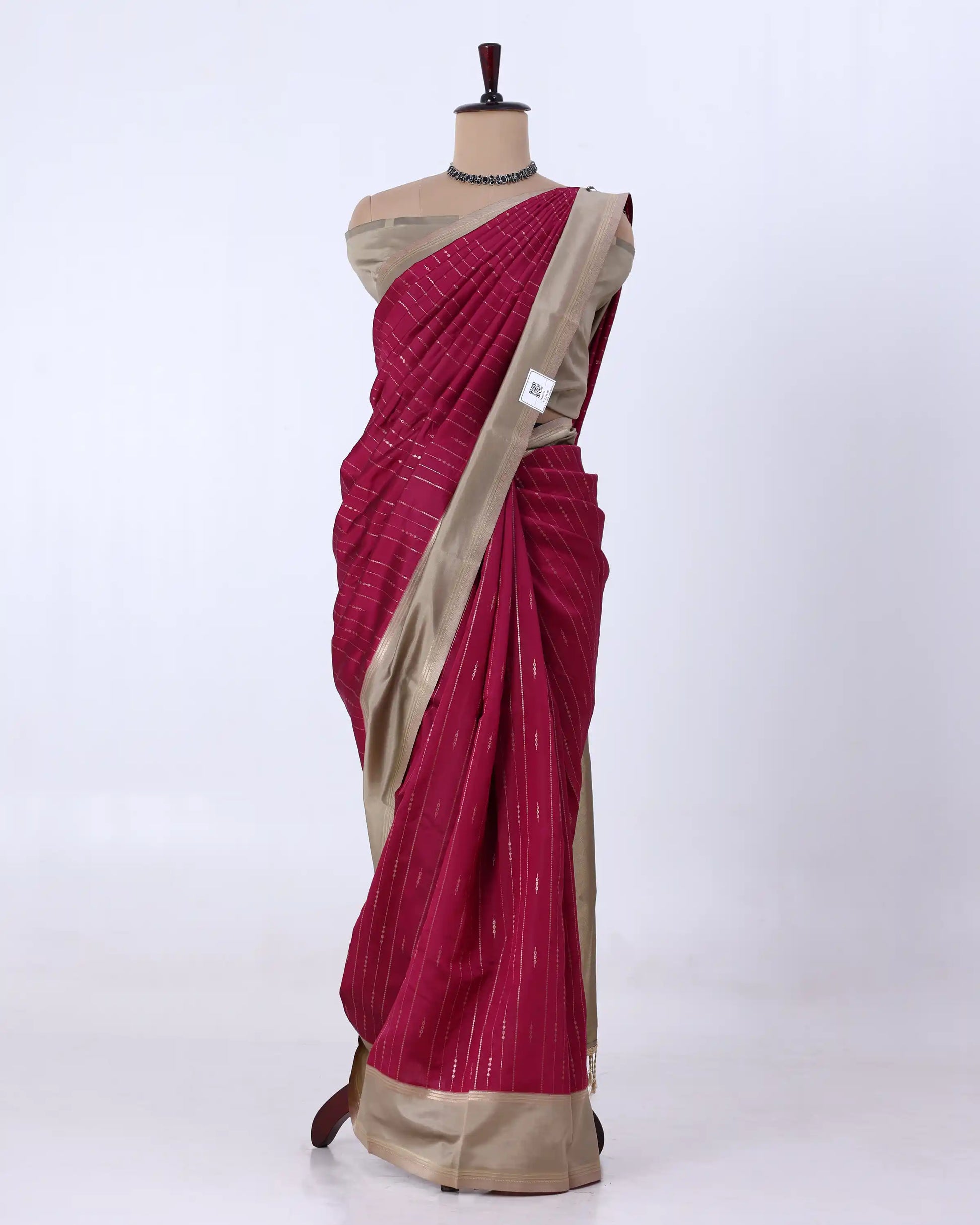 A deep magenta pink and beige striped cotton saree 