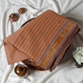 Peach Bengal Cotton Saree With Striped Weave Contrast Border And Woven Motifs  Folded Product View
