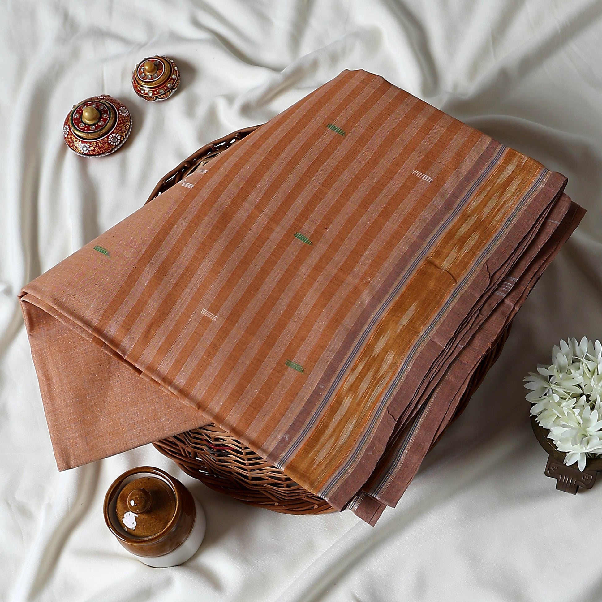 Peach Bengal Cotton Saree With Striped Weave Contrast Border And Woven Motifs  Folded Product View
