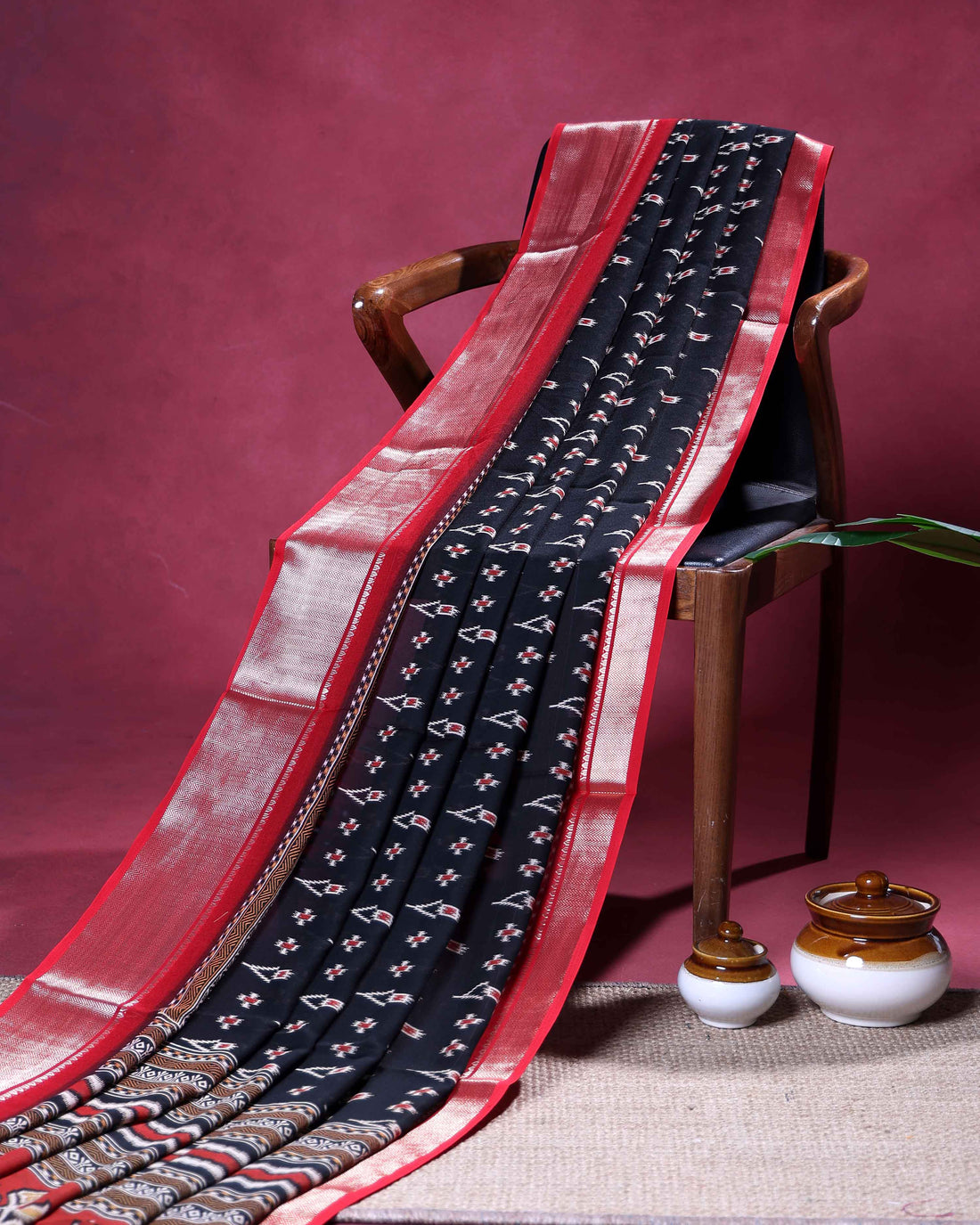 Traditional Dola Silk Saree with Intricate Ikkat Inspired Buta Motifs and Ornate Contrast Border - Black