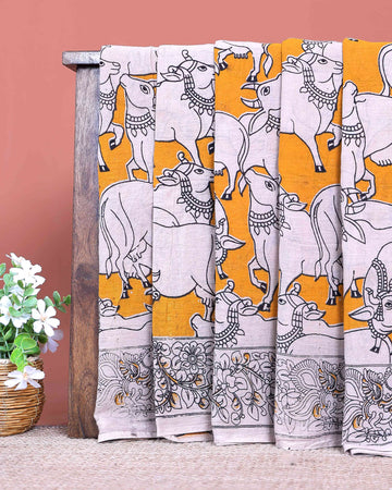 Traditional Handcrafted Kalamkari Cotton Saree with Traditional Cow Motifs and Floral Border - Yellow