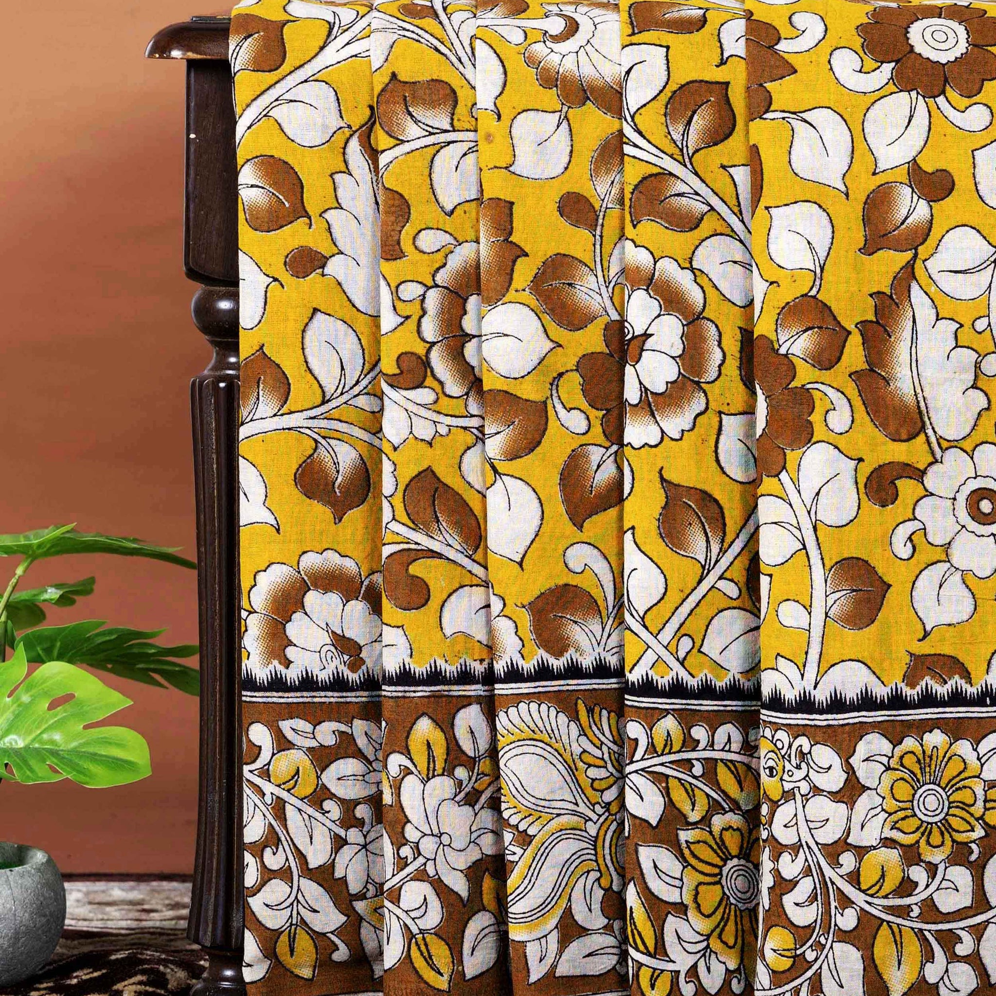 Traditional Handloom Kalamkari Cotton Saree with intricate all over botanical motifs and a contrasting decorative border - Yellow