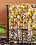 Traditional Handloom Kalamkari Cotton Saree with intricate all over botanical motifs and a contrasting decorative border - Yellow