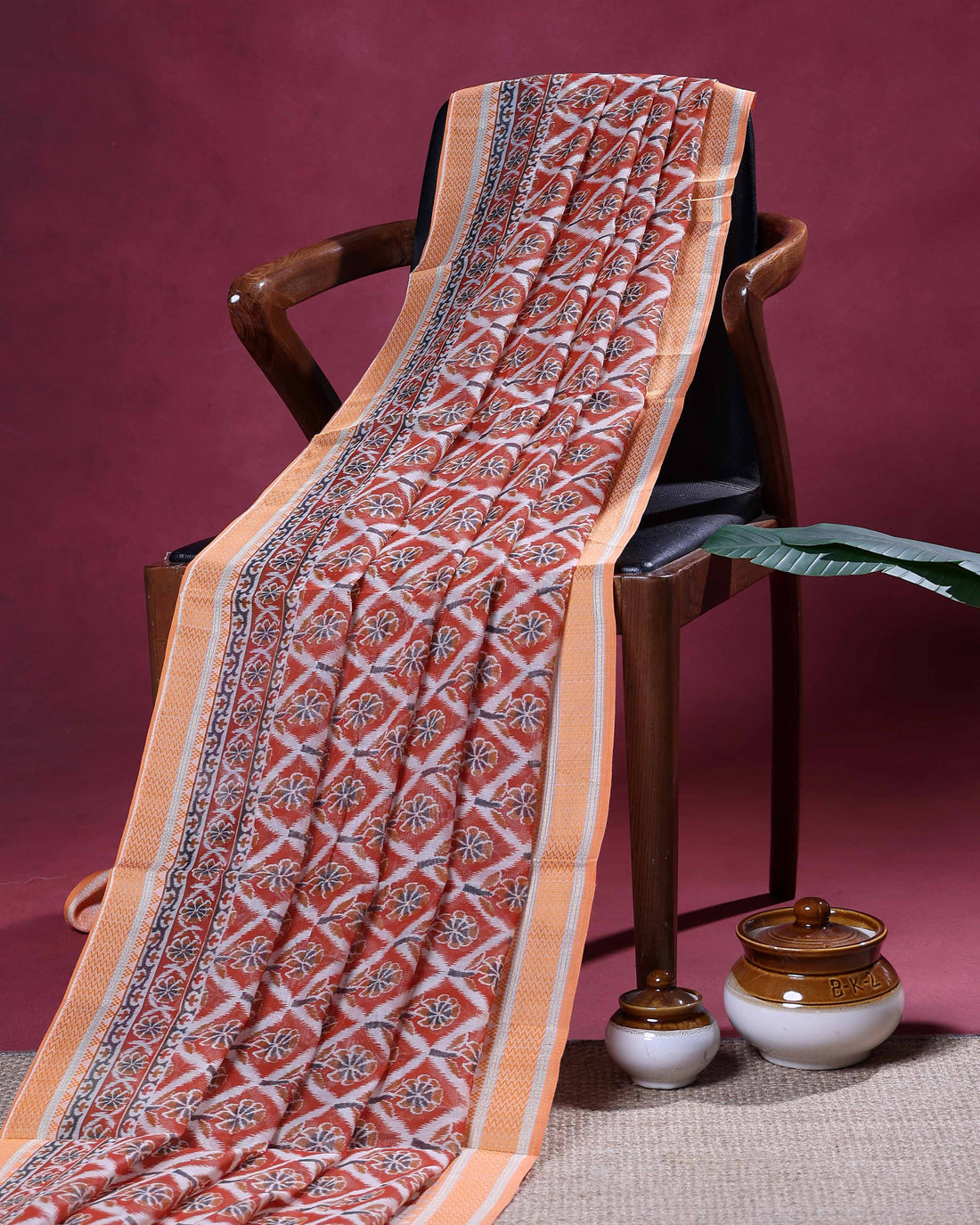 Traditional Linen Cotton Saree with Repeating Floral Diamond Pattern and Ornamental Woven Border - Rust Orange