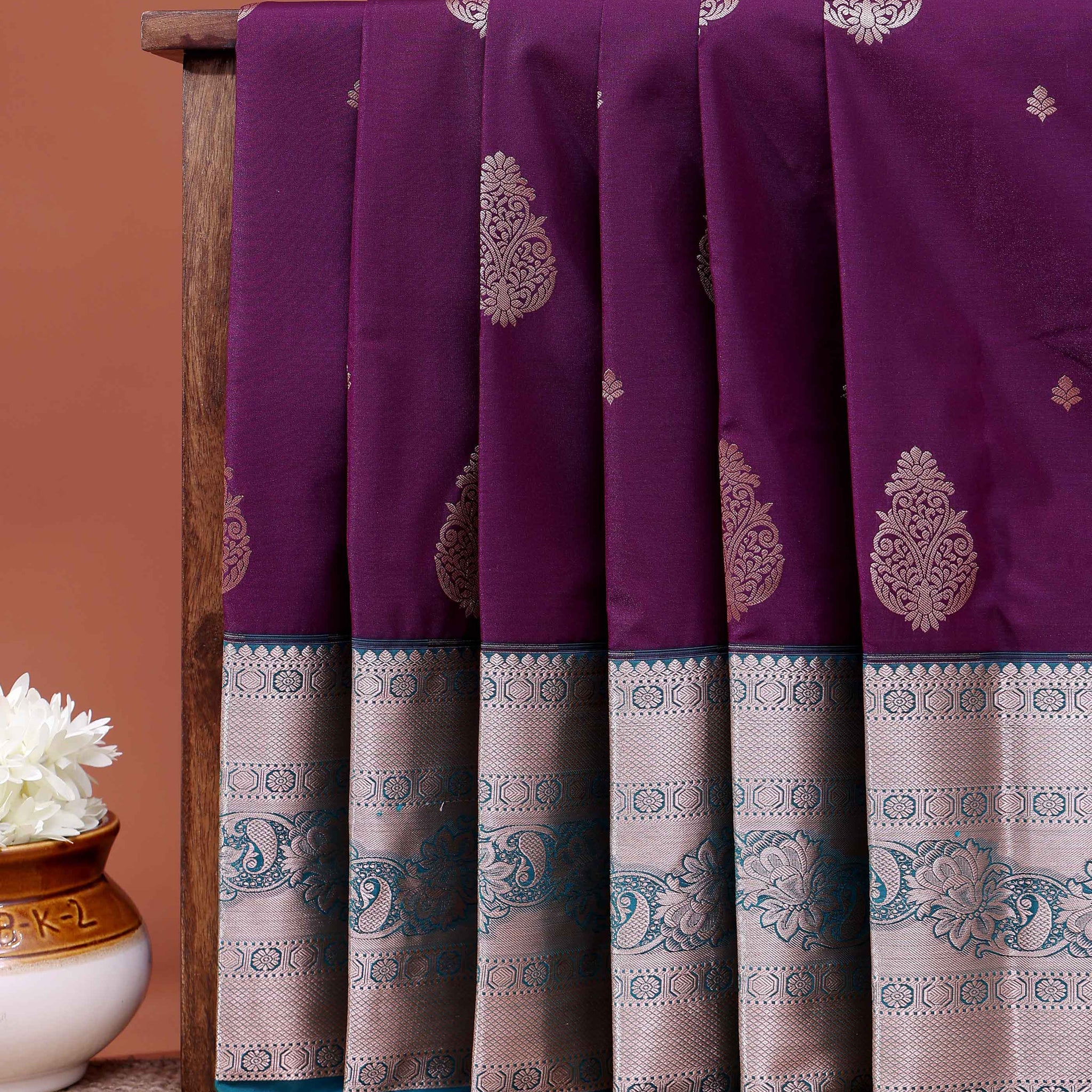 Traditional Niranjana Silk Saree with Intricate Zari Weave and Peacock Motif Border - Purple