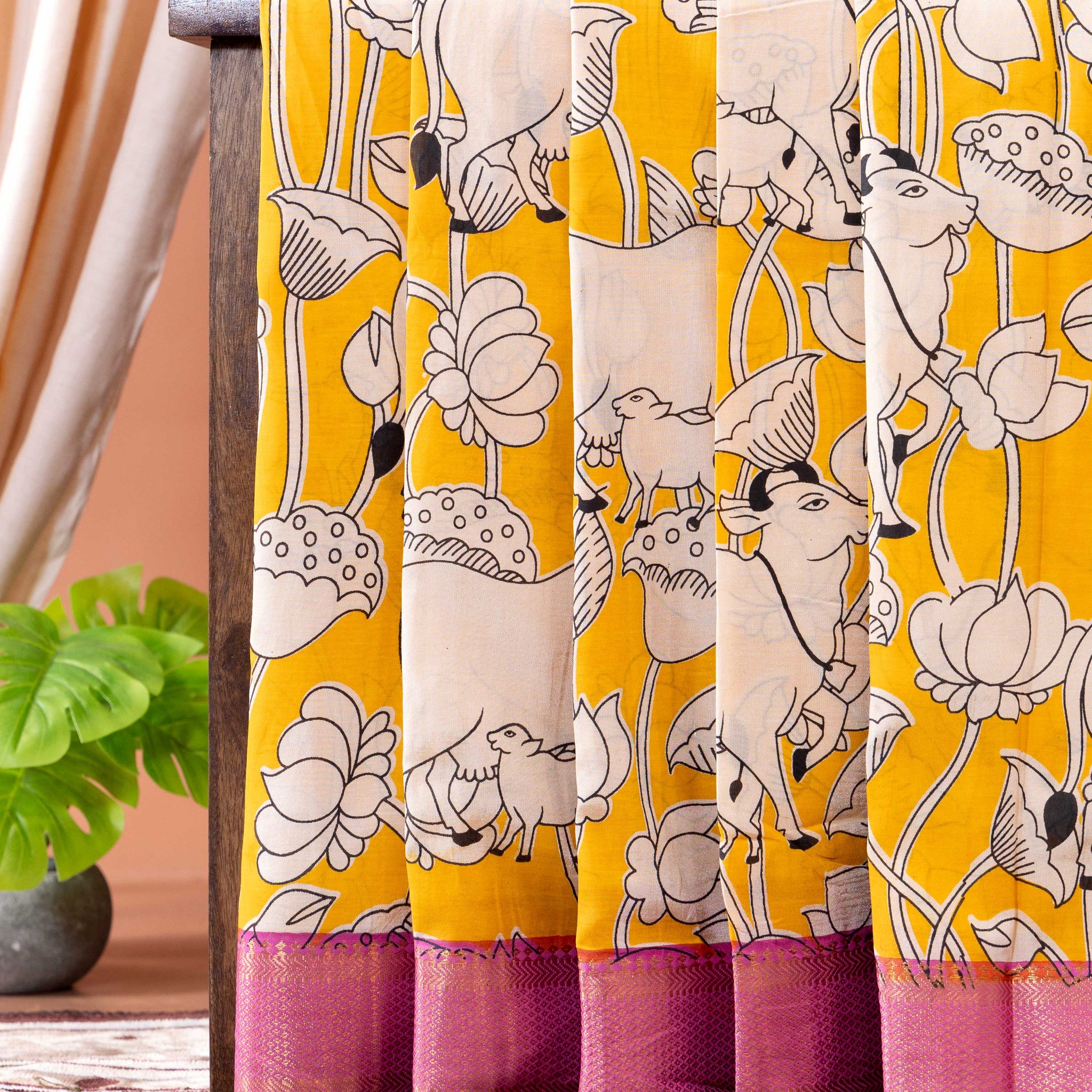 Traditional Semi Chanderi Saree with Intricate Cow and Lotus Pattern and Contrast Geometric Border- Yellow