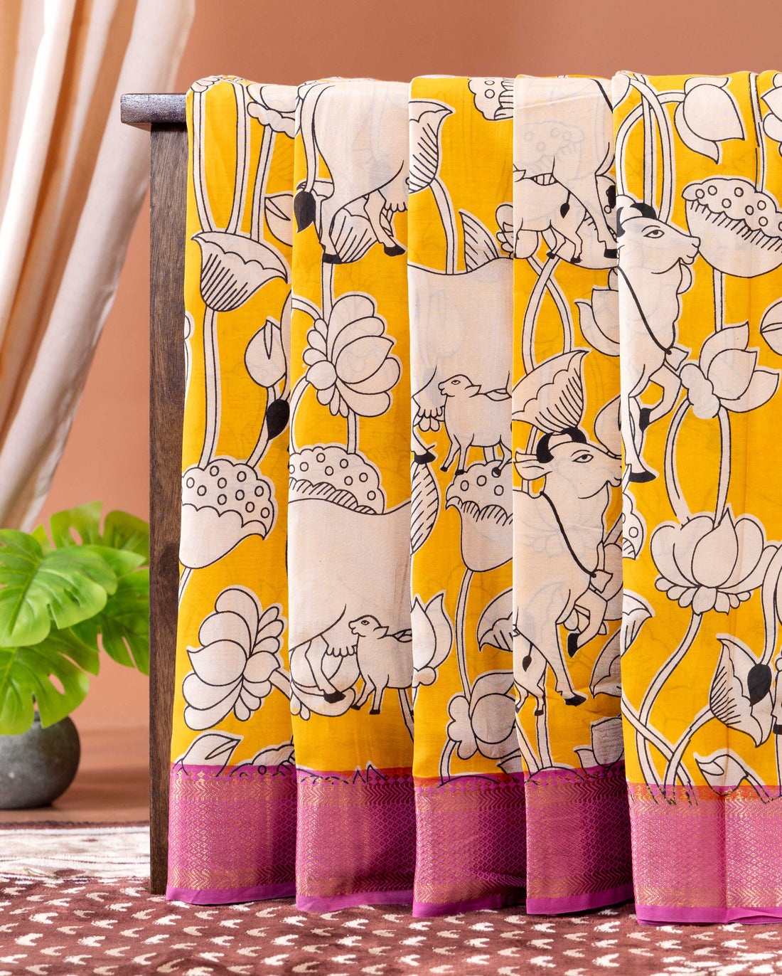 Traditional Semi Chanderi Saree with Intricate Cow and Lotus Pattern and Contrast Geometric Border- Yellow