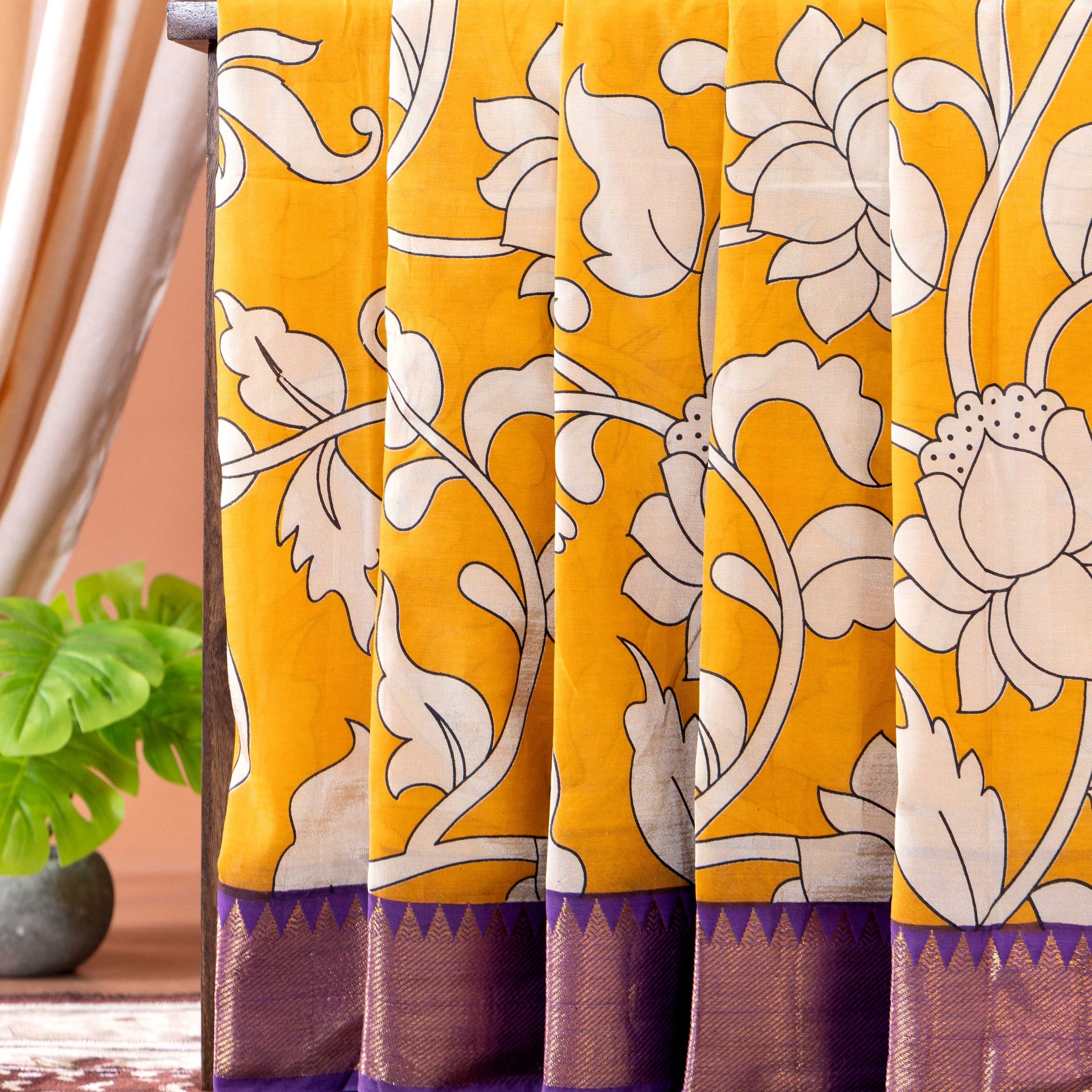 Traditional Semi Chanderi Saree with Kalamkari inspired floral print and a contrasting border - Yellow