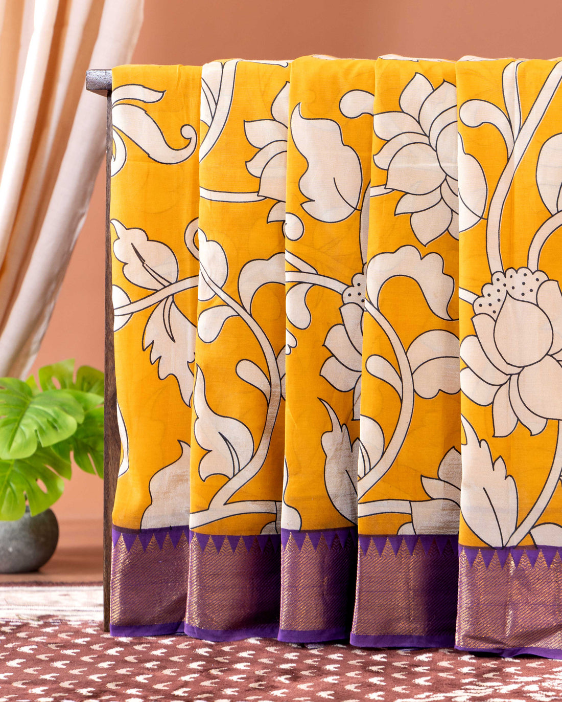 Traditional Semi Chanderi Saree with Kalamkari inspired floral print and a contrasting border - Yellow