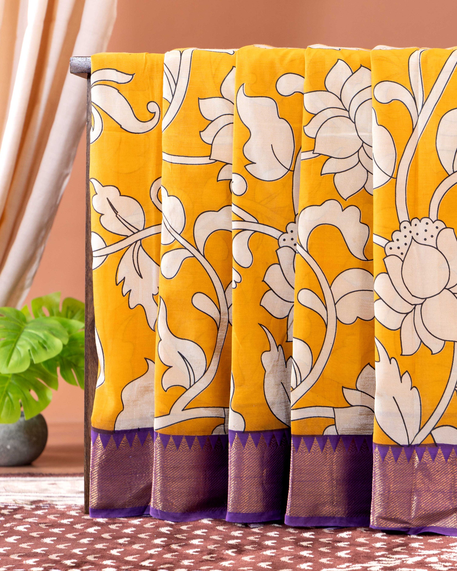 Traditional Semi Chanderi Saree with Kalamkari inspired floral print and a contrasting border - Yellow