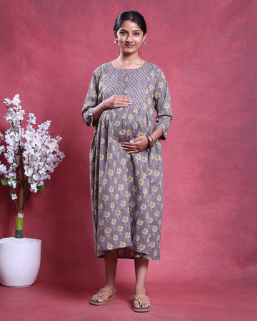 Maternity Wear with floral print in grey and yellow gathered waist and three quarter sleeves front view on model