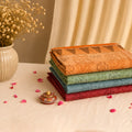 Bengal Cotton Saree With Woven Floral Motifs In Multicolor Shades Neatly Folded Stack Display - Front View